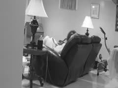 A concealed camera captures the wife engaging in sexual activity with her partner.